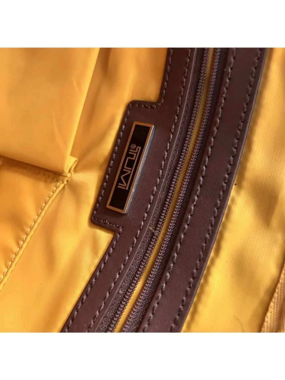 Tumi brown signature